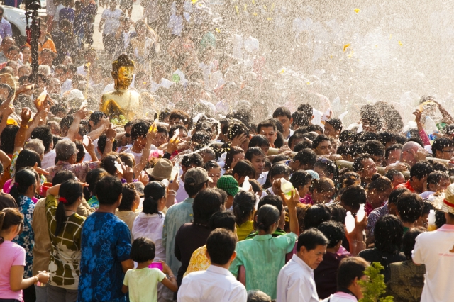 People celebrating Songkran Festival in Thailand. 
